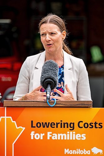 NIC ADAM / FREE PRESS
Environment and Climate Change Minister Tracy Schmidt speaks to press about Manitobas new electric vehicle rebate program in front of the home of EV owner Shelley Kowalchuck Tuesday.
240702 - Tuesday, July 02, 2024.

Reporter: Martin Cash