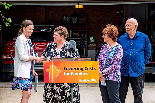 NIC ADAM / FREE PRESS
Environment and Climate Change Minister Tracy Schmidt (left) speaks to press about Manitobas new electric vehicle rebate program in front of the home of Shelley Kowalchuck and Gary Pedersen, two electric vehicle owners.
240702 - Tuesday, July 02, 2024.

Reporter: Martin Cash