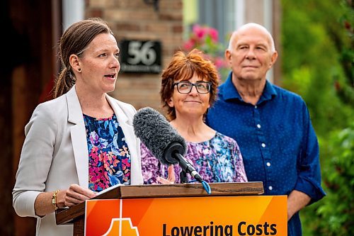 NIC ADAM / FREE PRESS
(From left) Environment and Climate Change Minister Tracy Schmidt speaks to press about Manitobas new electric vehicle rebate program in front of the home of Shelley Kowalchuck and Gary Pedersen, two electric vehicle owners.
240702 - Tuesday, July 02, 2024.

Reporter: Martin Cash