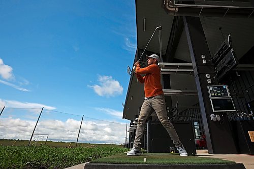 02072024
Riley Parker hits ball at Shanks Driving Range &amp; Grill on a warm Tuesday morning. 
(Tim Smith/The Brandon Sun)