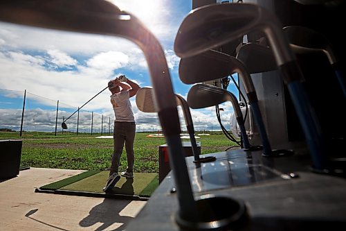 02072024
Riley Parker hits ball at Shanks Driving Range &amp; Grill on a warm Tuesday morning. 
(Tim Smith/The Brandon Sun)