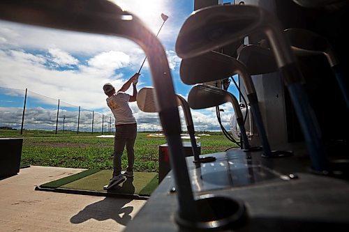 02072024
Riley Parker hits ball at Shanks Driving Range &amp; Grill on a warm Tuesday morning. 
(Tim Smith/The Brandon Sun)