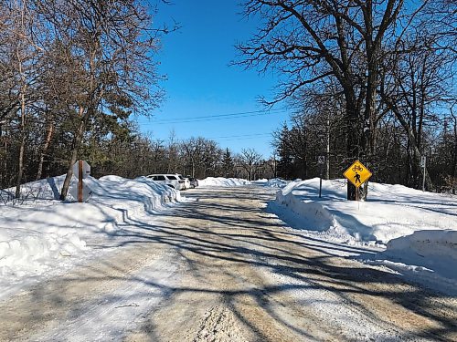 MIKE DEAL / WINNIPEG FREE PRESS

Winnipeg police say the body of Paul Enns, 43, was discovered in a car in this parking lot off Conservatory Drive at Assiniboine Park, just north of Corydon Avenue, when officers responded to a well-being call at about 3 a.m., Saturday, February 26, 2022.
A 15-year-old Stonewall girl is accused of murdering and robbing Enns.