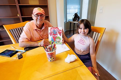 MIKE DEAL / FREE PRESS
Michael Bruneau president and CEO of Aurora Recovery Centre with Rosalia Dos Santos, 6, daughter to one of his employees at the reunification village as she gives him a painting she made for him.
Aurora Reunification Village, 873 Waverley Street, a private reunification centre that helps people in addictions treatment work towards building a life that includes their children.  
See Katie May story
240703 - Wednesday, July 03, 2024.