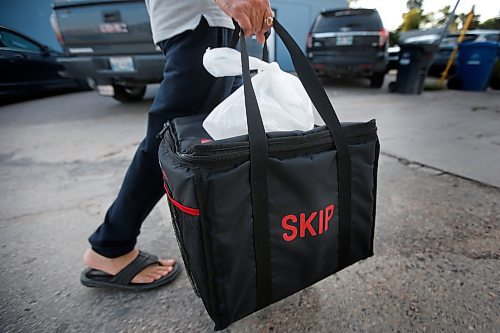 JOHN WOODS / WINNIPEG FREE PRESS



A driver from Skip The Dishes, the food delivery service, picks up some food at local Winnipeg restaurant Monday, July 30, 2018. The service provider is having labour issues.