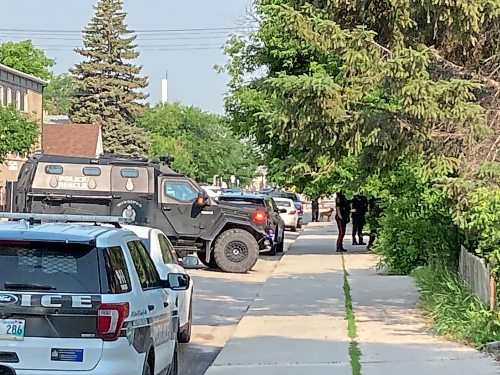 The armoured police vehicle outside a home on the 400 block of Mountain Avenue on Thursday morning. (Adam Treusch / Free Press)
