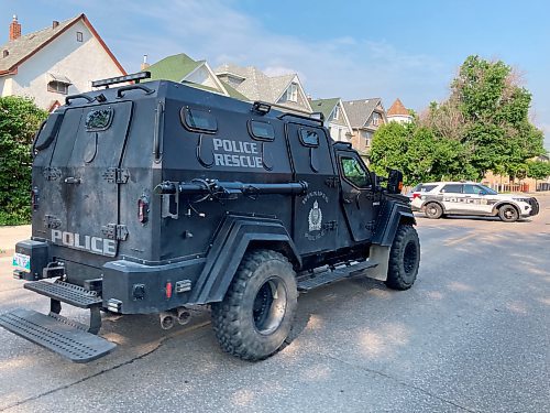 The armoured police vehicle approaches a home on the 400 block of Mountain Avenue on Thursday morning. (Adam Treusch / Free Press)
