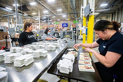 MIKAELA MACKENZIE / FREE PRESS

Maryann Mills (left), Maryann Asuntion, and Jorlyn Lumbang work in the finishing department at Pollard Banknote in Winnipeg on Wednesday, July 3, 2024. The company partners with lotteries around the world to design, market, and print lottery games.

For Aaron story.

