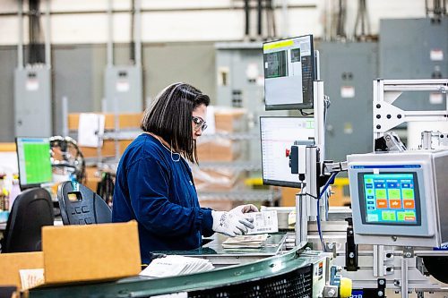 MIKAELA MACKENZIE / FREE PRESS

Jiokso Acuna works in the finishing department at Pollard Banknote in Winnipeg on Wednesday, July 3, 2024. The company partners with lotteries around the world to design, market, and print lottery games.

For Aaron story.

