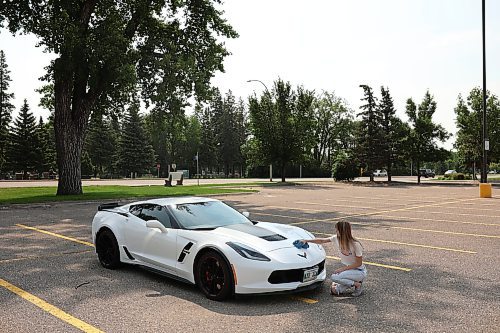 04072024
Haley Foxton polishes her 2018 Corvette Grand Sport in the parking lot of Landmark Cinemas on Thursday, scrubbing off the bugs from her highway travels. Foxton was debating taking in the Downtown Cruise Night with her car. 
(Tim Smith/The Brandon Sun)