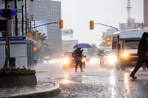 MIKAELA MACKENZIE / FREE PRESS

Thunderstorms drench pedestrians in downtown Winnipeg on Thursday, July 4, 2024. 

Standup.

