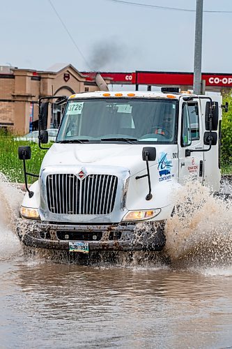 NIC ADAM / FREE PRESS
Cars struggle along a flooded Brookside Blvd, just south of Inkster Blvd, after the thunderstorm on Thursday afternoon.
240704 - Thursday, July 04, 2024.

Reporter: