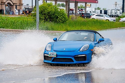 NIC ADAM / FREE PRESS
Cars struggle along a flooded Brookside Blvd, just south of Inkster Blvd, after the thunderstorm on Thursday afternoon.
240704 - Thursday, July 04, 2024.

Reporter: