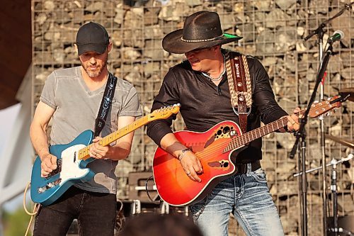 04072024
Manitoba Country musician Ryan Keown and his band perform for a large crowd at the Fusion Credit Union Stage at the Riverbank Discovery Centre on Thursday evening as part of the Music in the Park series. 
(Tim Smith/The Brandon Sun)