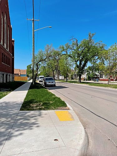 RUTH BONNEVILLE / FREE PRESS
A few dozen parking spaces from Burrows Avenue to prevent vehicles from blocking drivers’ sight lines. May 23, 2024