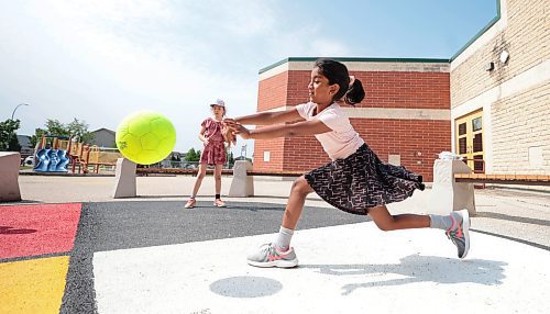 Ruth Bonneville / Free Press

LOCAL - summer camp

Kids signed up with the City of Winnipeg's, What&#x2019;s Up Camp, (6-12 years) at Island Lakes School enjoying playing hot-dog tag, four square, helping each other climb the play structure and making new friends in their first week of  their summer holidays, Thursday. 

Kids push the ball to another square while playing four square Thursday. 

July 4th,  2024

