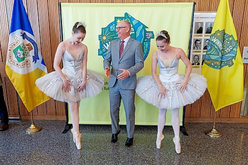 MIKE DEAL / FREE PRESS
Mayor Scott Gillingham tries to demonstrate his En pointe skills while RWB ballerinas, Katie Bonnell (left) and Emilie Lewis (right) show him how it&#x2019;s done. The Mayor was hosting representatives from four of the major local performing arts organizations: Manitoba Opera, Winnipeg Symphony Orchestra, Royal Winnipeg Ballet and Royal Manitoba Theatre Centre, for a media announcement at City Hall to invite Winnipeggers to join him on Saturday, October 5 to attend the Mayor&#x2019;s Ball, a fundraising event to help support the organizations.
240705 - Friday, July 05, 2024.