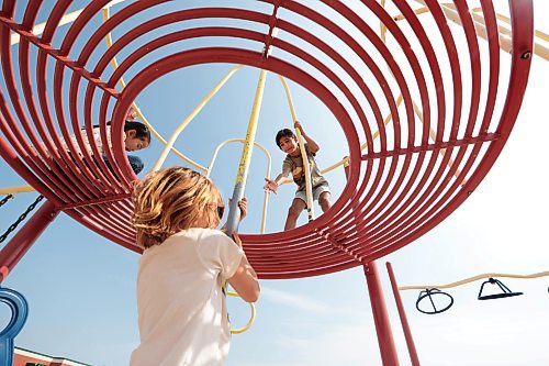 Ruth Bonneville / Free Press

LOCAL - summer camp

Kids signed up with the City of Winnipeg's, What&#x2019;s Up Camp, (6-12 years) at Island Lakes School enjoying playing hot-dog tag, four square, helping each other climb the play structure and making new friends in their first week of  their summer holidays, Thursday. 

Friends help each other climb up the pole on the play structure at the school Thursday. 

July 4th,  2024

