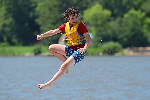 05072024
Will Preston is launched through the air into the cool water of Minnedosa Lake while enjoying a hot Friday afternoon with friends at the Splish Splash Water Park on the lake.
(Tim Smith/The Brandon Sun)