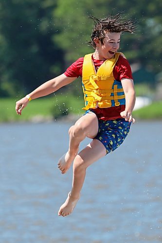 05072024
Will Preston is launched through the air into the cool water of Minnedosa Lake while enjoying a hot Friday afternoon with friends at the Splish Splash Water Park on the lake.
(Tim Smith/The Brandon Sun)