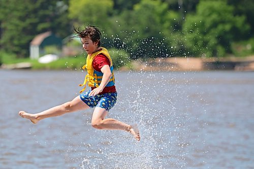 05072024
Will Preston is launched through the air into the cool water of Minnedosa Lake while enjoying a hot Friday afternoon with friends at the Splish Splash Water Park on the lake.
(Tim Smith/The Brandon Sun)