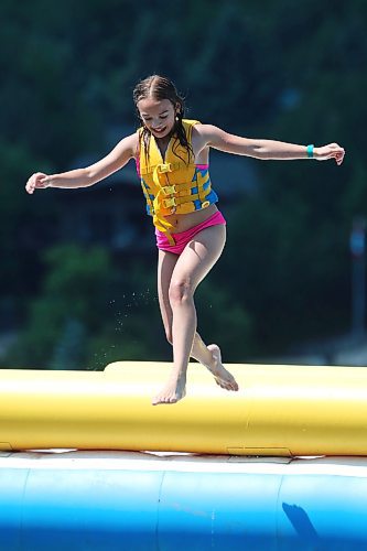 05072024
Leighton MacKay leaps into Minnedosa Lake from atop a large inflatable while enjoying a hot Friday afternoon with family at the Splish Splash Water Park on the lake.
(Tim Smith/The Brandon Sun)