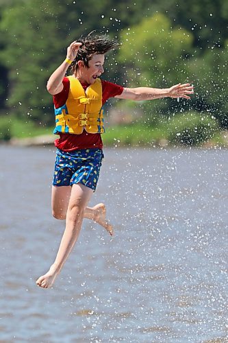 05072024
Will Preston is launched through the air into the cool water of Minnedosa Lake while enjoying a hot Friday afternoon with friends at the Splish Splash Water Park on the lake.
(Tim Smith/The Brandon Sun)