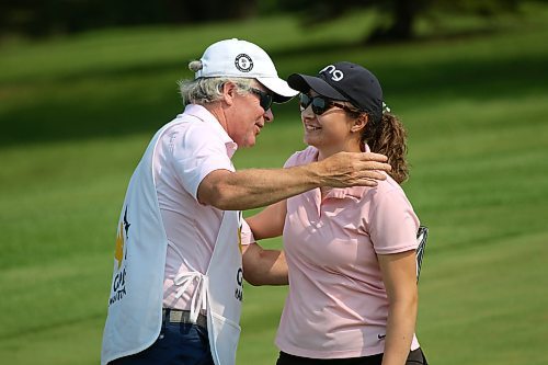 Addison Kartusch, right, hugs her dad and caddie Cory after winning the Golf Manitoba women's amateur championship on Sunday at Minnedosa Golf and Country Club. (Thomas Friesen/The Brandon Sun)