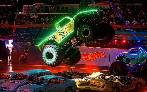 JOHN WOODS / FREE PRESS
A monster truck jumps some cars at the Hot Wheels Monster Truck live Glow Party in Winnipeg Sunday, July 7, 2024. 

Reporter: ?