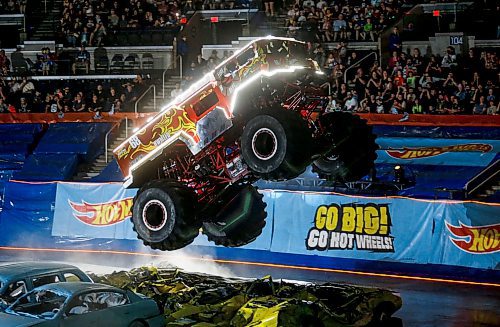 JOHN WOODS / FREE PRESS
A monster truck jumps some cars at the Hot Wheels Monster Truck live Glow Party in Winnipeg Sunday, July 7, 2024. 

Reporter: ?