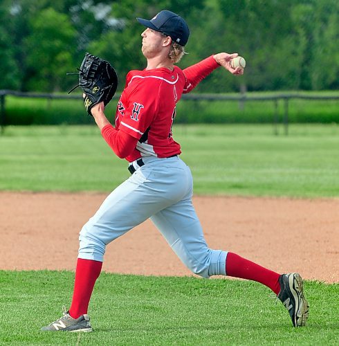 Hamiota Red Sox first baseman Ben Couvier fires the ball across the diamond to third base during warmup in Restion prior to a South West Baseball League tilt Sunday night. The Red Sox skunked the host Rockets 5-0. Couvier is fourth on the team with four RBI, and seventh with a .300 batting average. (Jules Xavier/The Brandon Sun)