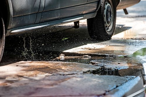 MIKAELA MACKENZIE / FREE PRESS

A car drives around a pothole on Campbell Street (between Academy Road and Wellington Crescent) on Monday, July 8, 2024. 

For Joyanne story.

