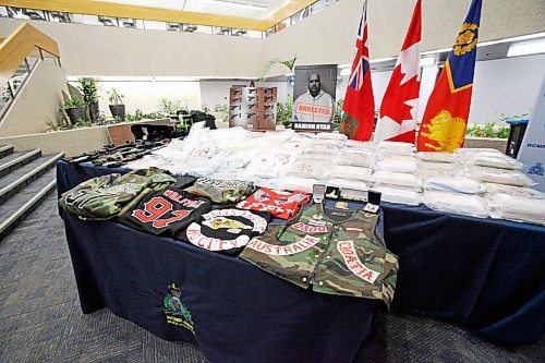 A large quantity of drugs, cash and outlaw motorcycle club patched clothing at RCMP D Division Headquarters, seized as part of Project Divergent. ERIK PINDERA/FREE PRESS