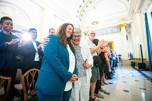 MIKAELA MACKENZIE / FREE PRESS

Carla Compton is embraced by her mother, Adel Compton, after being sworn in as the new NDP MLA for Tuxedo at the Manitoba Legislative Building on Monday, July 8, 2024. 

For Carol story.

