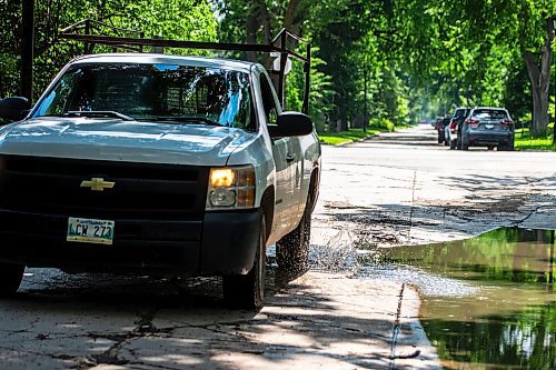 MIKAELA MACKENZIE / FREE PRESS

A truck drives around a pothole on Campbell Street (between Academy Road and Wellington Crescent) on Monday, July 8, 2024. 

For Joyanne story.

