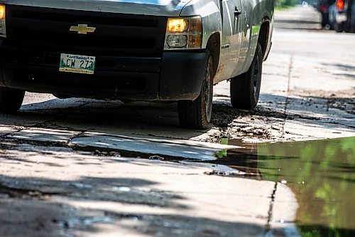 MIKAELA MACKENZIE / FREE PRESS

A truck drives around a pothole on Campbell Street (between Academy Road and Wellington Crescent) on Monday, July 8, 2024. 

For Joyanne story.

