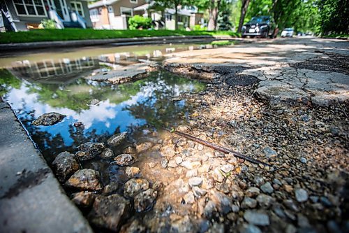 MIKAELA MACKENZIE / FREE PRESS

A pothole, deep enough to expose the rebar beneath, on Campbell Street between Academy Road and Wellington Crescent on Monday, July 8, 2024. 

For Joyanne story.

