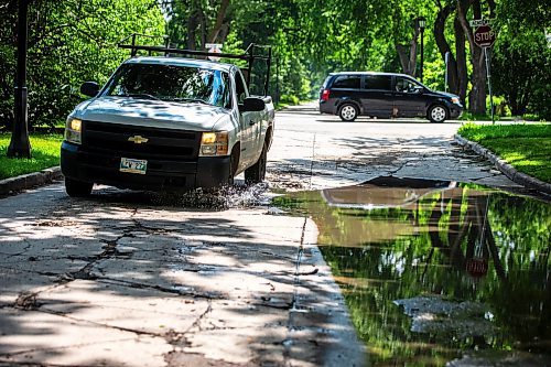 MIKAELA MACKENZIE / FREE PRESS

A truck drives around a pothole on Campbell Street (between Academy Road and Wellington Crescent) on Monday, July 8, 2024. 

For Joyanne story.

