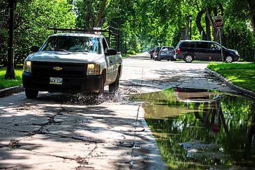 MIKAELA MACKENZIE / FREE PRESS

A truck drives around a pothole on Campbell Street (between Academy Road and Wellington Crescent) on Monday, July 8, 2024. 

For Joyanne story.

