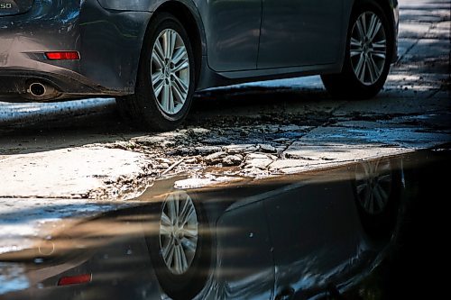 MIKAELA MACKENZIE / FREE PRESS

A car drives around a pothole on Campbell Street (between Academy Road and Wellington Crescent) on Monday, July 8, 2024. 

For Joyanne story.

