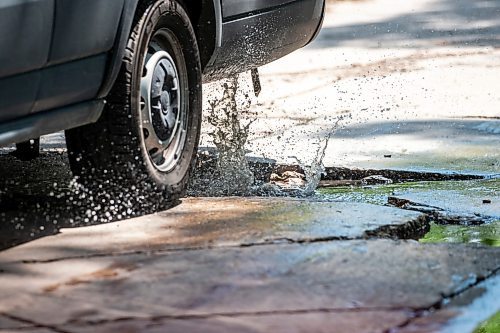 MIKAELA MACKENZIE / FREE PRESS

A car drives around a pothole on Campbell Street (between Academy Road and Wellington Crescent) on Monday, July 8, 2024. 

For Joyanne story.

