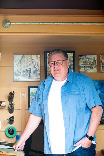 MIKAELA MACKENZIE / FREE PRESS

Artist (and art teacher by day) Tim Toews in his backyard studio on Monday, July 8, 2024. His ink and wash paintings of the Winnipeg are tiny masterpieces, crammed full of detail in a tight 8x8 space.

For AV story.

