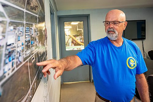 NIC ADAM / FREE PRESS
St. Andrews Airport is celebrating its 60th anniversary this month since it first opened.
St. Andrews Airport chair person, Russ Paradoski, points to an old areal photo of the airport on Monday morning.
240708 - Monday, July 08, 2024.

Reporter: Matt Frank