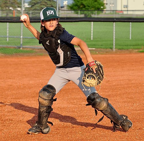 Glenboro's Gavin Anderson works on his catching skills during drills held for the two Team West squads who are preparing for the Manitoba Summer Games in Dauphin starting on Aug. 11. (Photos by Jules Xavier/The Brandon Sun)