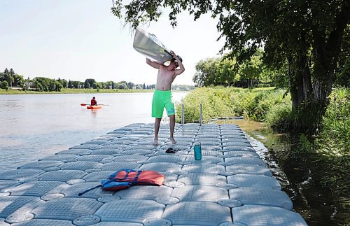 \Ruth Bonneville / Free Press

Standup -  Canoe and Kayak Club 

MB. Canoe and Kayak Club student, Luke Stow (12yrs, green shorts), finishes up a 2-hour, morning, training session and carries his canoe up to the club on the Red River Tuesday.  

Luke compete in the high-kneeling canoe category, and is part of a larger group of kids that train 7x per week at the club during the summer months located on the banks of the Red River on Churchill Drive.

July 9th,  2024

