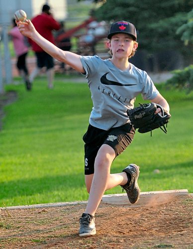 Team Orange players who won the Brandon Baseball 13U house league championship were honing their skills Monday night at Simplot Field to prepare for this weekend's 13U Tier 1 provincials in Morden. Here, one of the Team Orange hurlers shows off his body language as he works on his pitches in the bullpen. (Photos by Jules Xavier/The Brandon Sun)