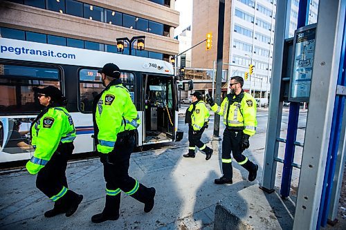 MIKAELA MACKENZIE / FREE PRESS

Transit safety officers walk down Graham Avenue on their first day on the job on Tuesday, Feb. 20, 2024. 

For Chris story.
