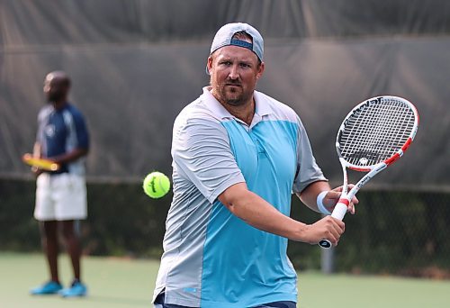 Andrew Arksey returns a volley during a game of doubles at the Wheat City Tennis Club last week. He has reached the national level as a tennis official in the sport. (Perry Bergson/The Brandon Sun)
 