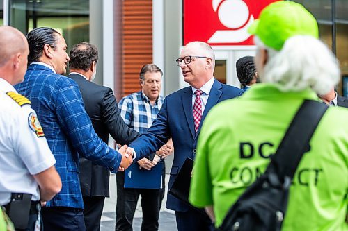 MIKAELA MACKENZIE / FREE PRESS

Premier Wab Kinew (left) and mayor Scott Gillingham shake hands after making an announcement on improving downtown safety at a press conference at True North Square on Tuesday, July 9, 2024. 

For Chris story.

