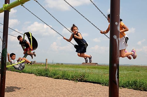 09072024
Kids play on a set of swings at Sioux Valley Dakota Nation on a hot and cloudy Tuesday afternoon. (Tim Smith/The Brandon Sun)